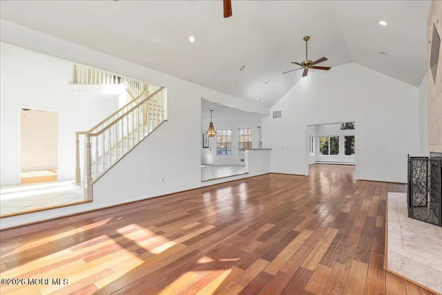 a view of kitchen and hall with wooden floor