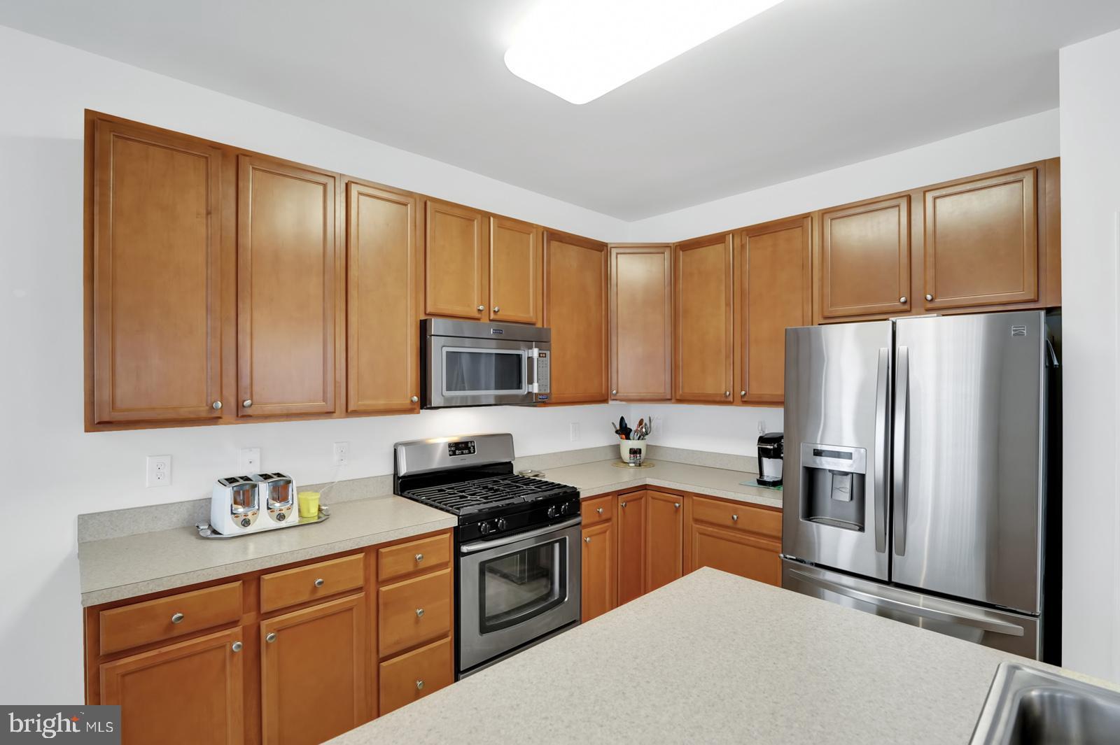 37 Spring Arbor Drive Middletown, DE 19709 - Photo 14 of 37 a kitchen with stainless steel appliances granite countertop a refrigerator stove and sink