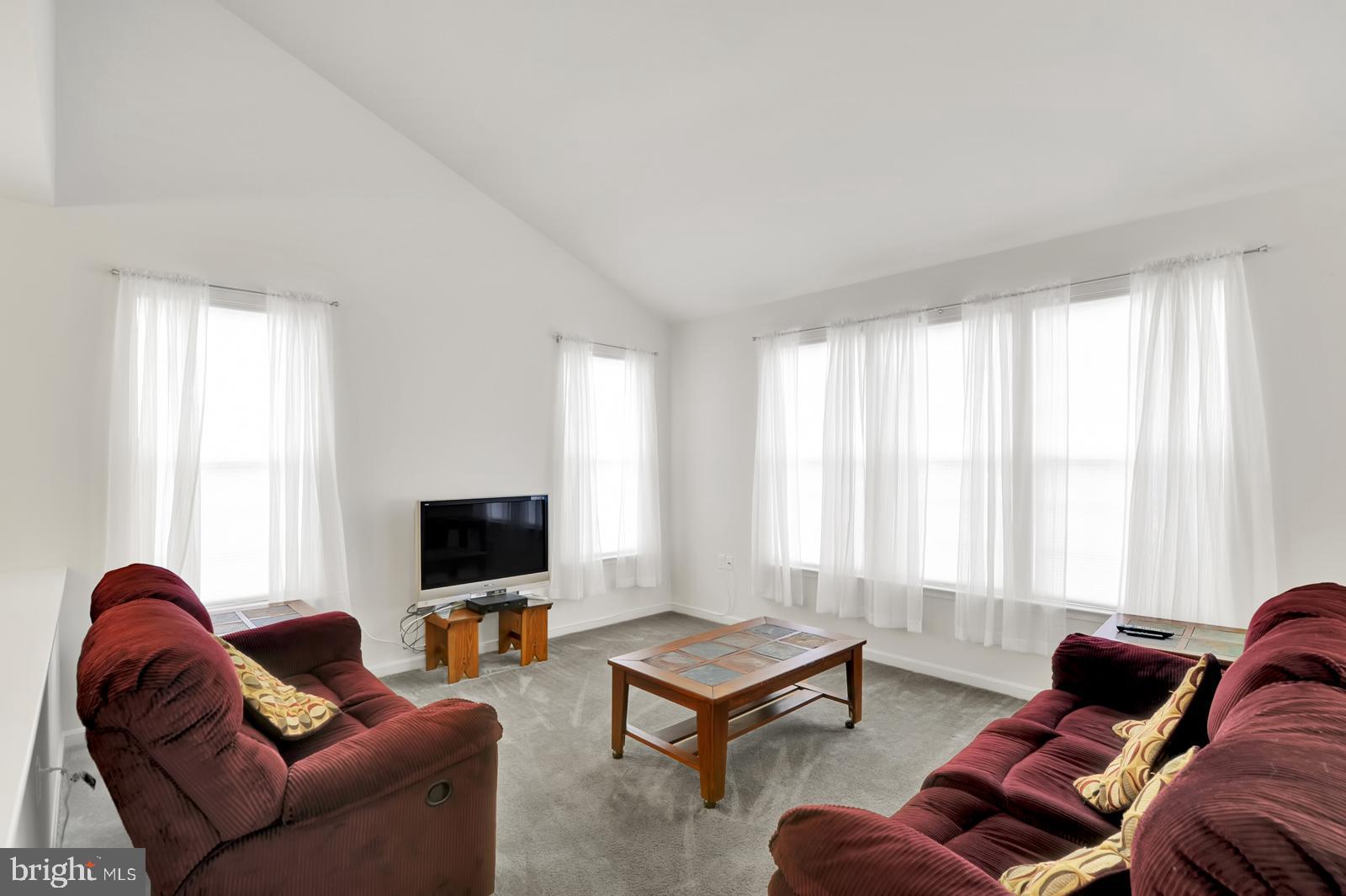 37 Spring Arbor Drive Middletown, DE 19709 - Photo 17 of 37 a living room with furniture a rug and a window