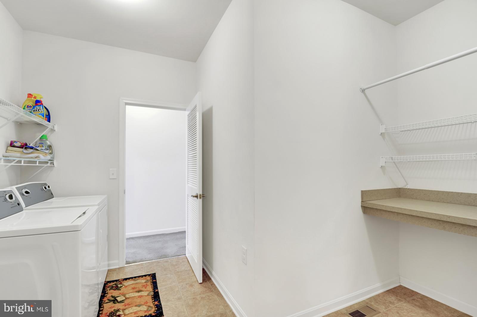 37 Spring Arbor Drive Middletown, DE 19709 - Photo 22 of 37 a storage room with a washer and dryer