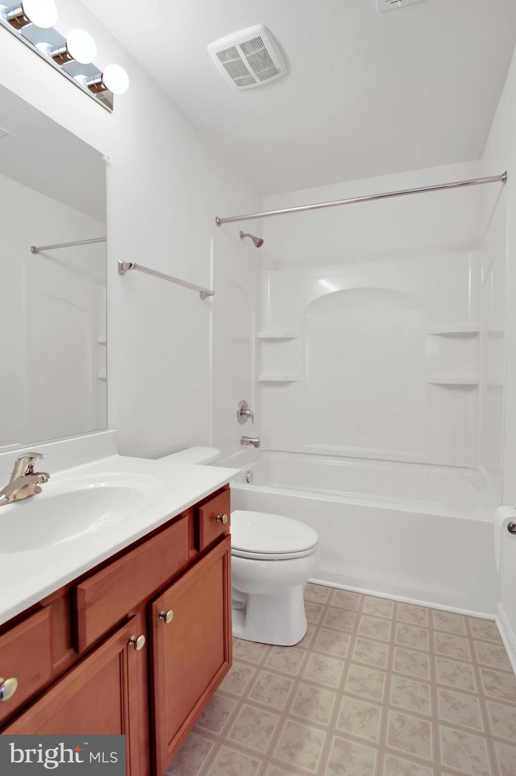 37 Spring Arbor Drive Middletown, DE 19709 - Photo 27 of 37 a bathroom with a sink a toilet and shower