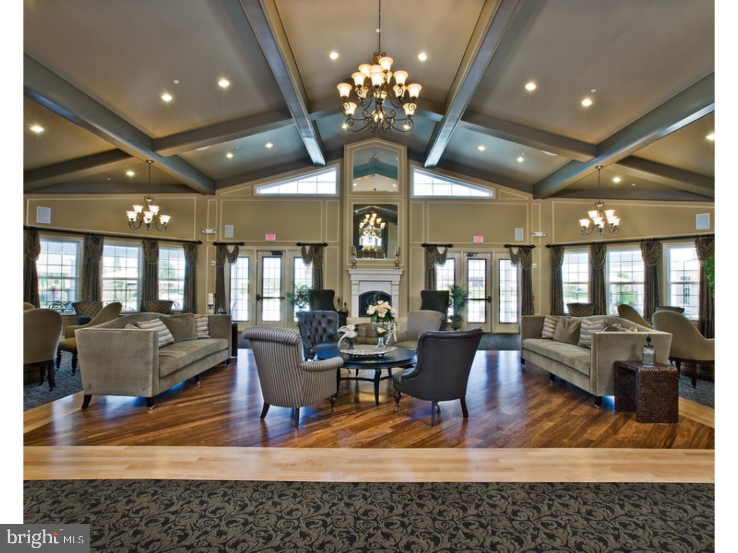 37 Spring Arbor Drive Middletown, DE 19709 - Photo 33 of 37 a living room with fireplace furniture and a chandelier