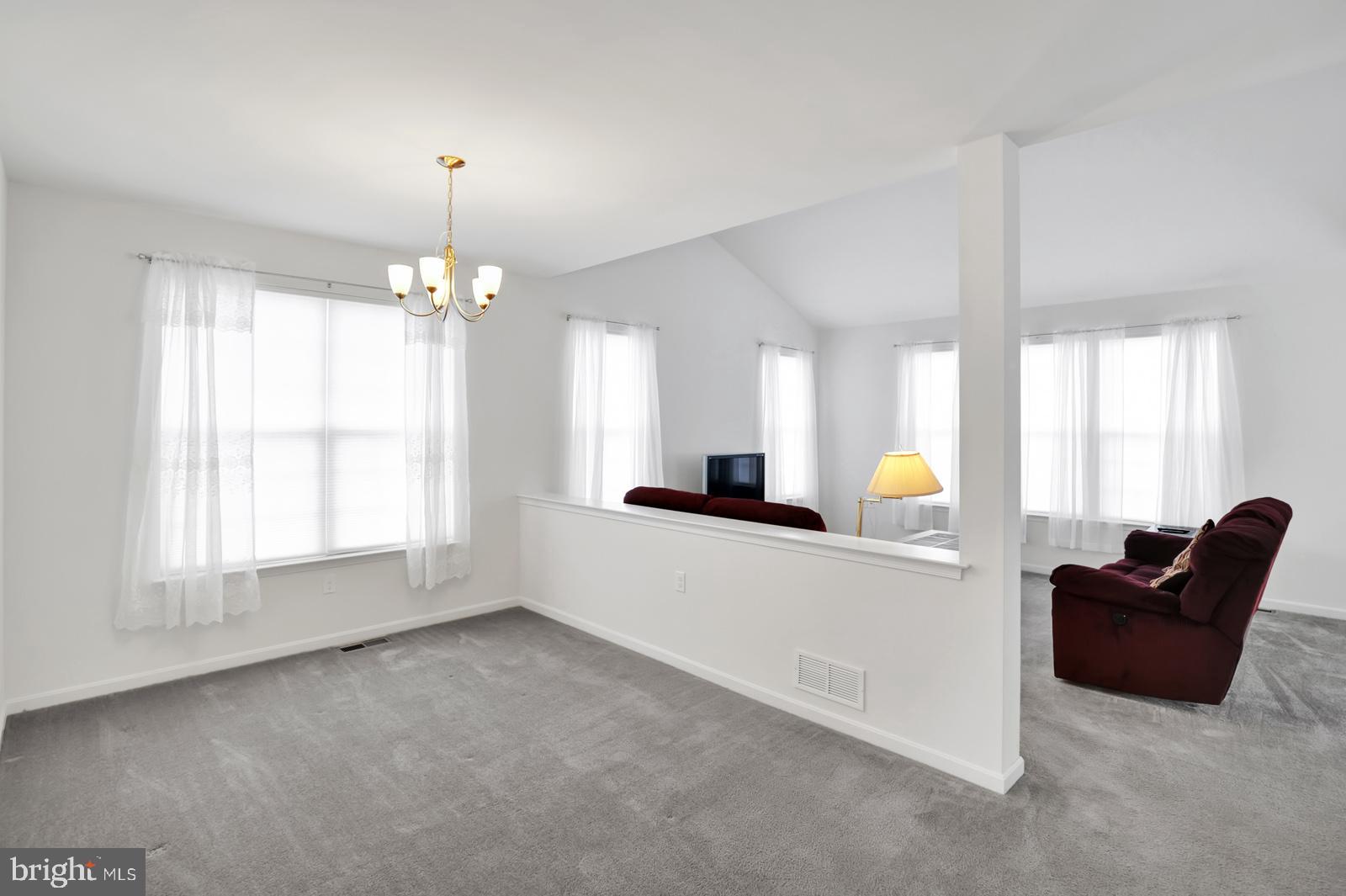 37 Spring Arbor Drive Middletown, DE 19709 - Photo 9 of 37 a living room with furniture and a chandelier