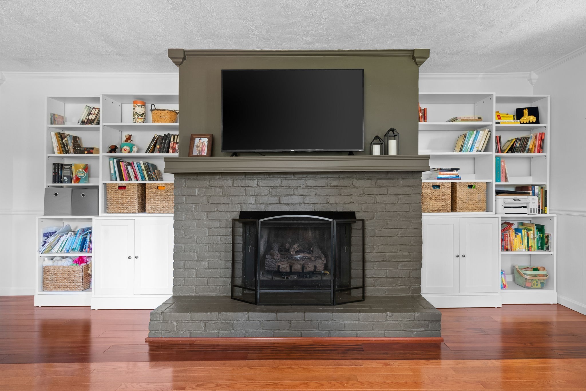 3680 Zentmyer Road Crofton, KY 42217 - Photo 19 of 43 a living room with a bookshelf and a fireplace