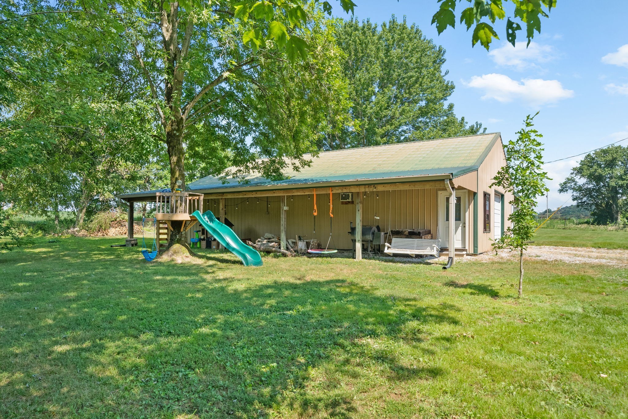 3680 Zentmyer Road Crofton, KY 42217 - Photo 37 of 43 a view of a house with backyard porch and sitting area