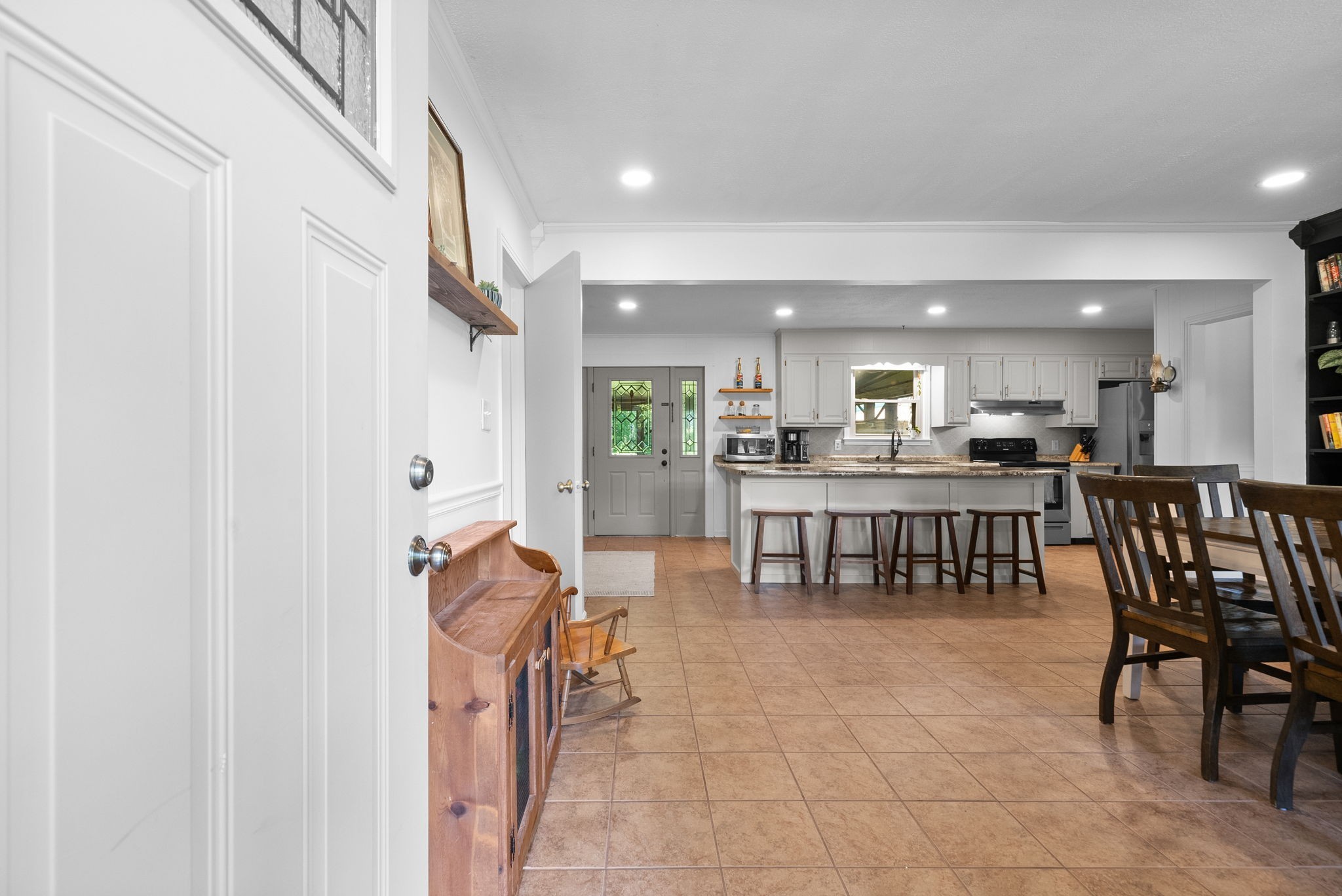 3680 Zentmyer Road Crofton, KY 42217 - Photo 8 of 43 a kitchen with stainless steel appliances a refrigerator and a dining table