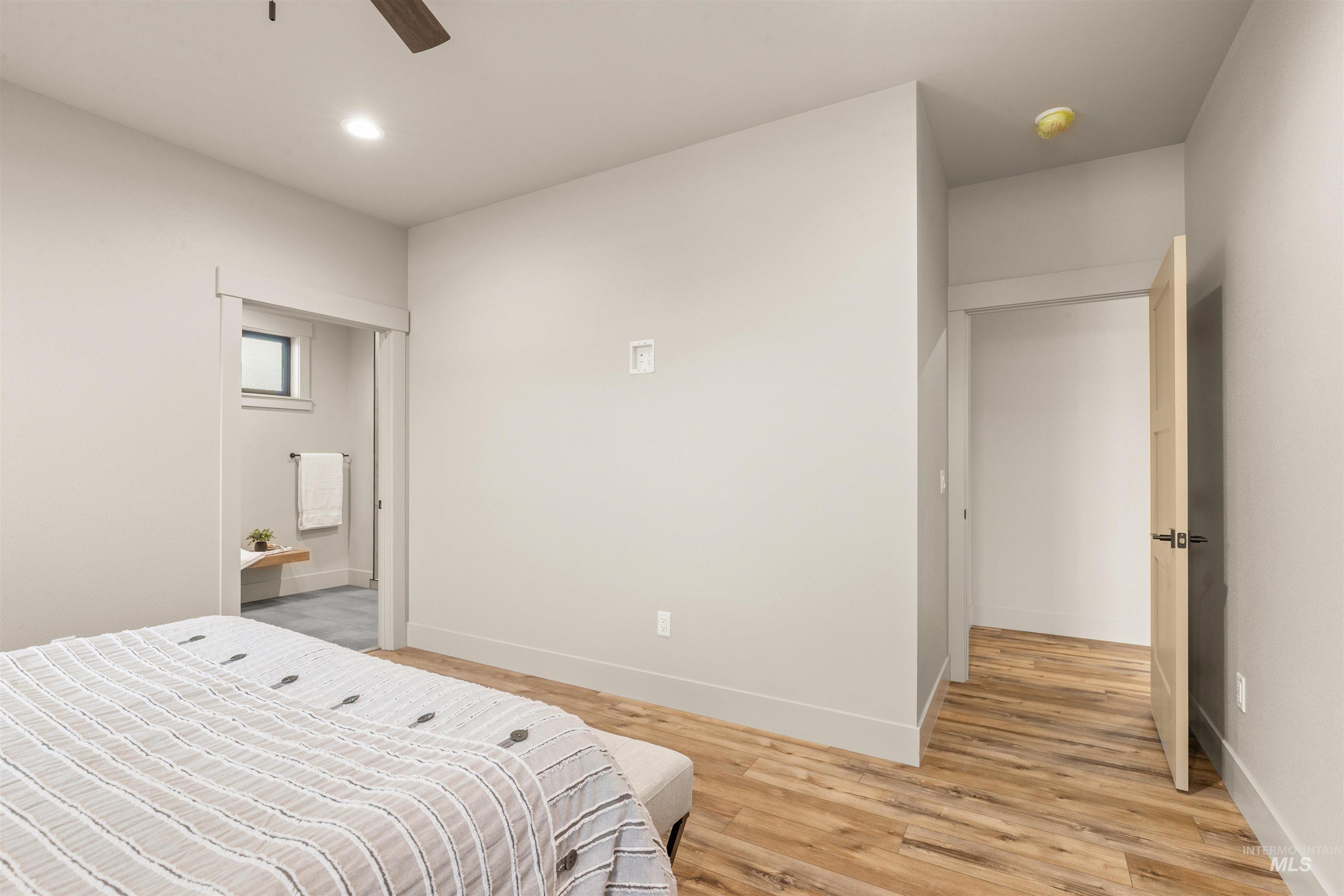 335 Warner Avenue Lewiston, ID 83501 - Photo 24 of 43 Bedroom featuring light wood-style flooring, recessed lighting, ceiling fan, and connected bathroom