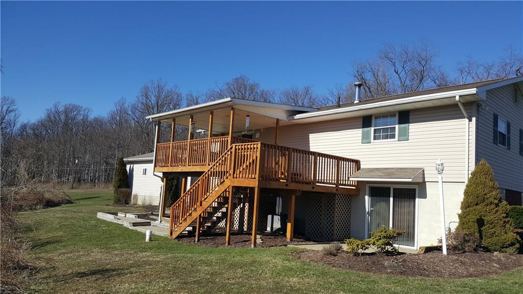 493 Pleasant View Smock Road Smock, PA 15480 - Photo 19 of 24 exterior of home 17x12 covered deck, 12x12 concrete patio 12x10 lower deck
