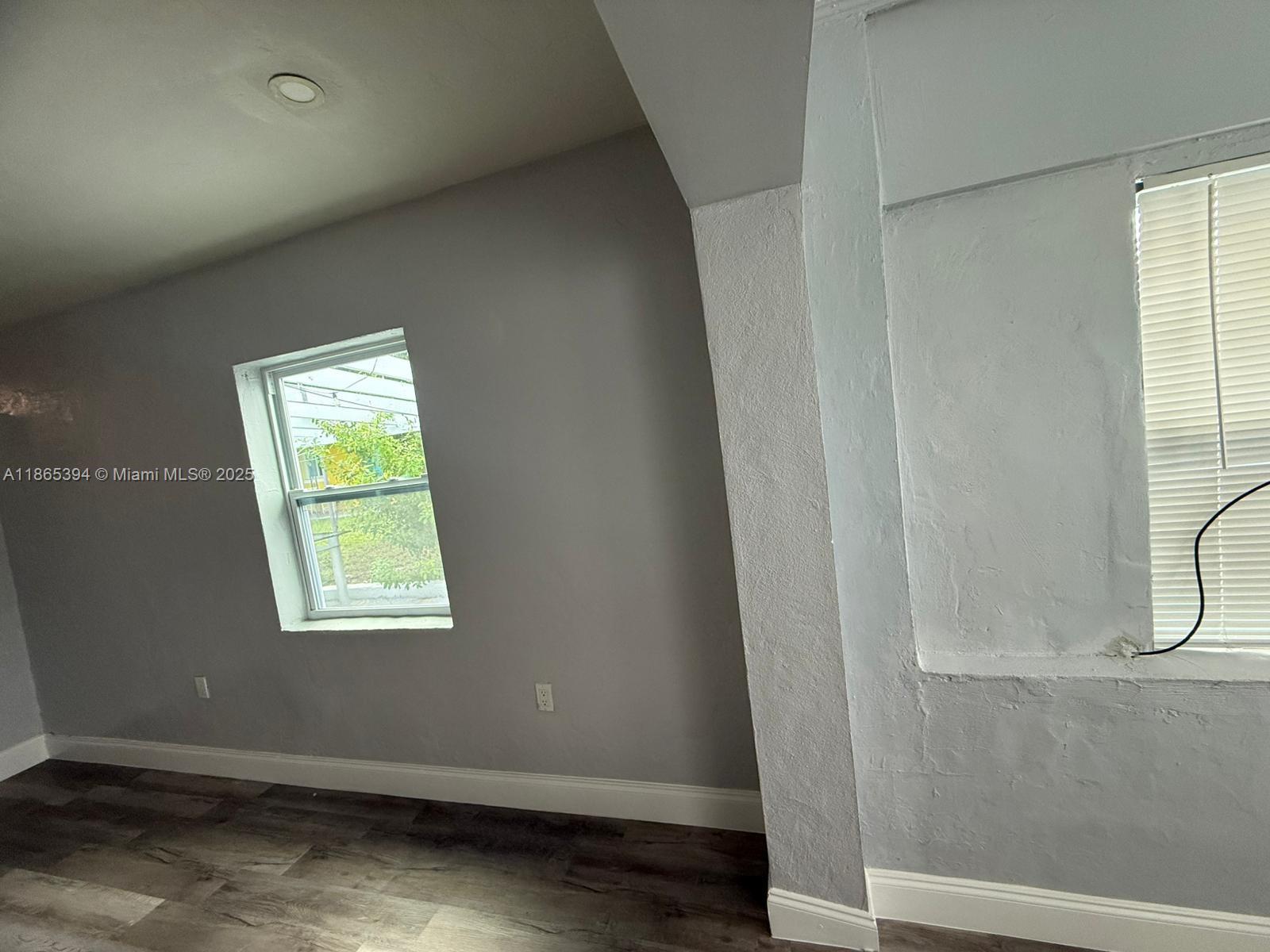 173 West 16th Street, Unit A Riviera Beach, FL 33404 - Photo 16 of 17 an empty room with windows