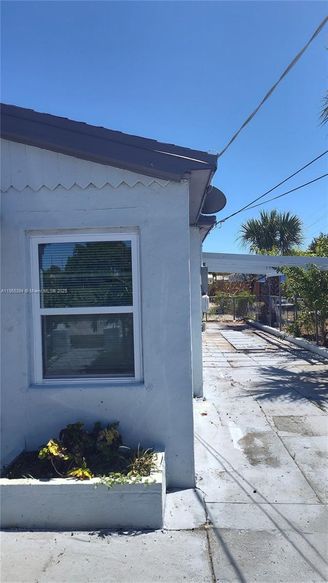 173 West 16th Street, Unit A Riviera Beach, FL 33404 - Photo 17 of 17 a front view of a house with a yard