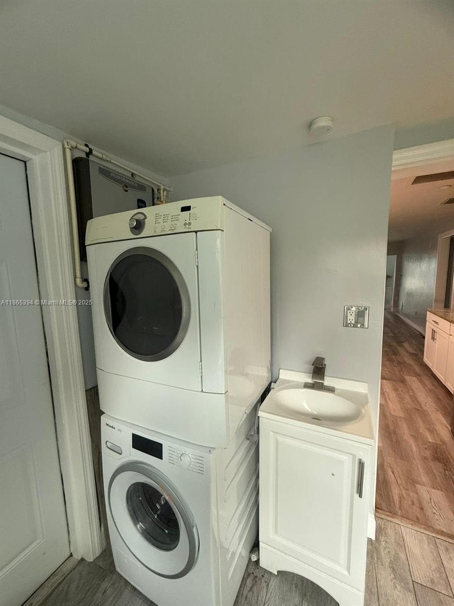 173 West 16th Street, Unit A Riviera Beach, FL 33404 - Photo 4 of 17 a utility room with dryer and washer