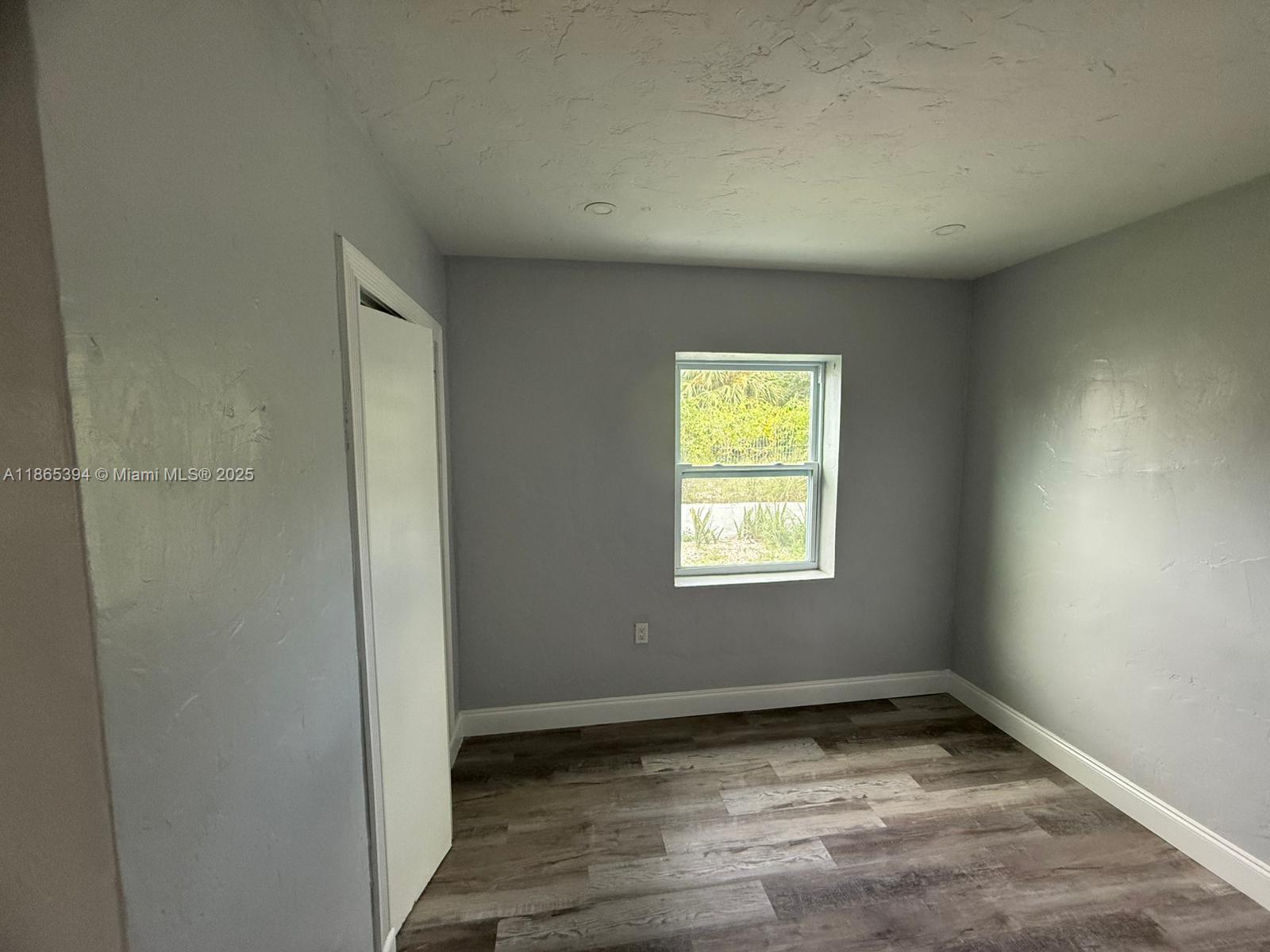 173 West 16th Street, Unit A Riviera Beach, FL 33404 - Photo 5 of 17 a view of empty room with window