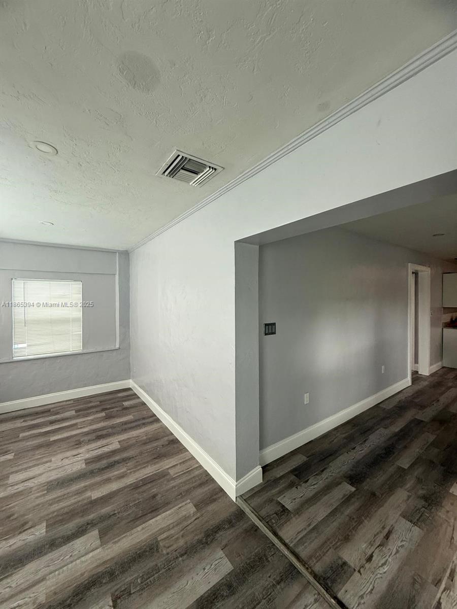 173 West 16th Street, Unit A Riviera Beach, FL 33404 - Photo 8 of 17 a view of an empty room and window