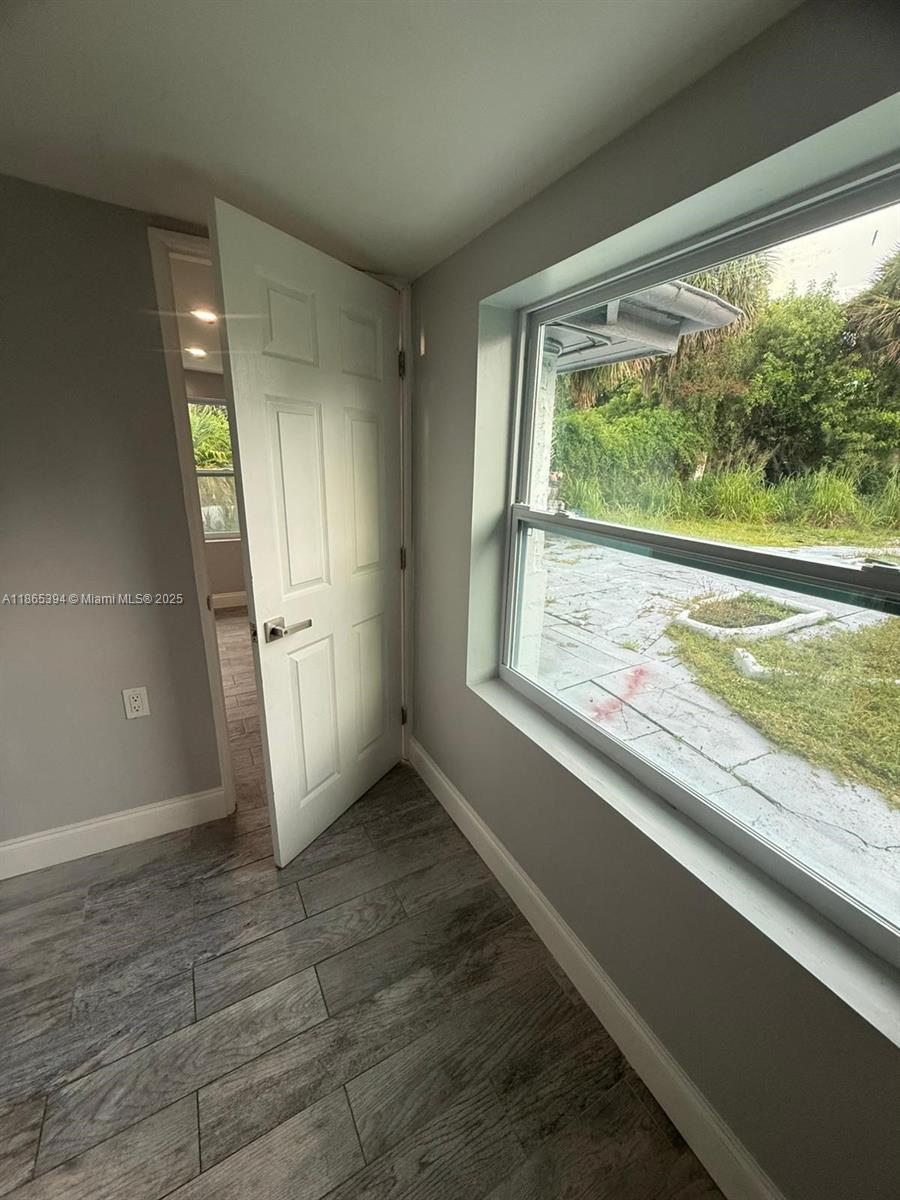 173 West 16th Street, Unit A Riviera Beach, FL 33404 - Photo 10 of 17 a view of an empty room and window