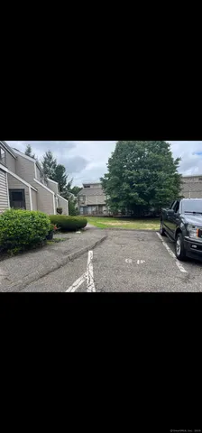 a view of yard with car parked