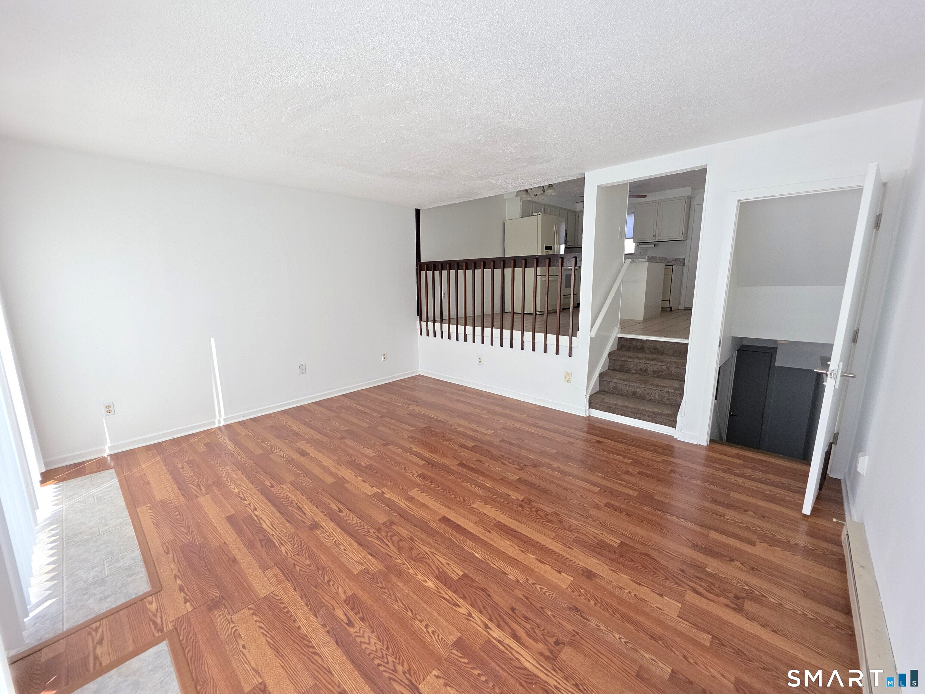 51 Brook Street, Unit 6A Naugatuck, CT 06770 - Photo 14 of 32 a bedroom with a bed and wooden floor