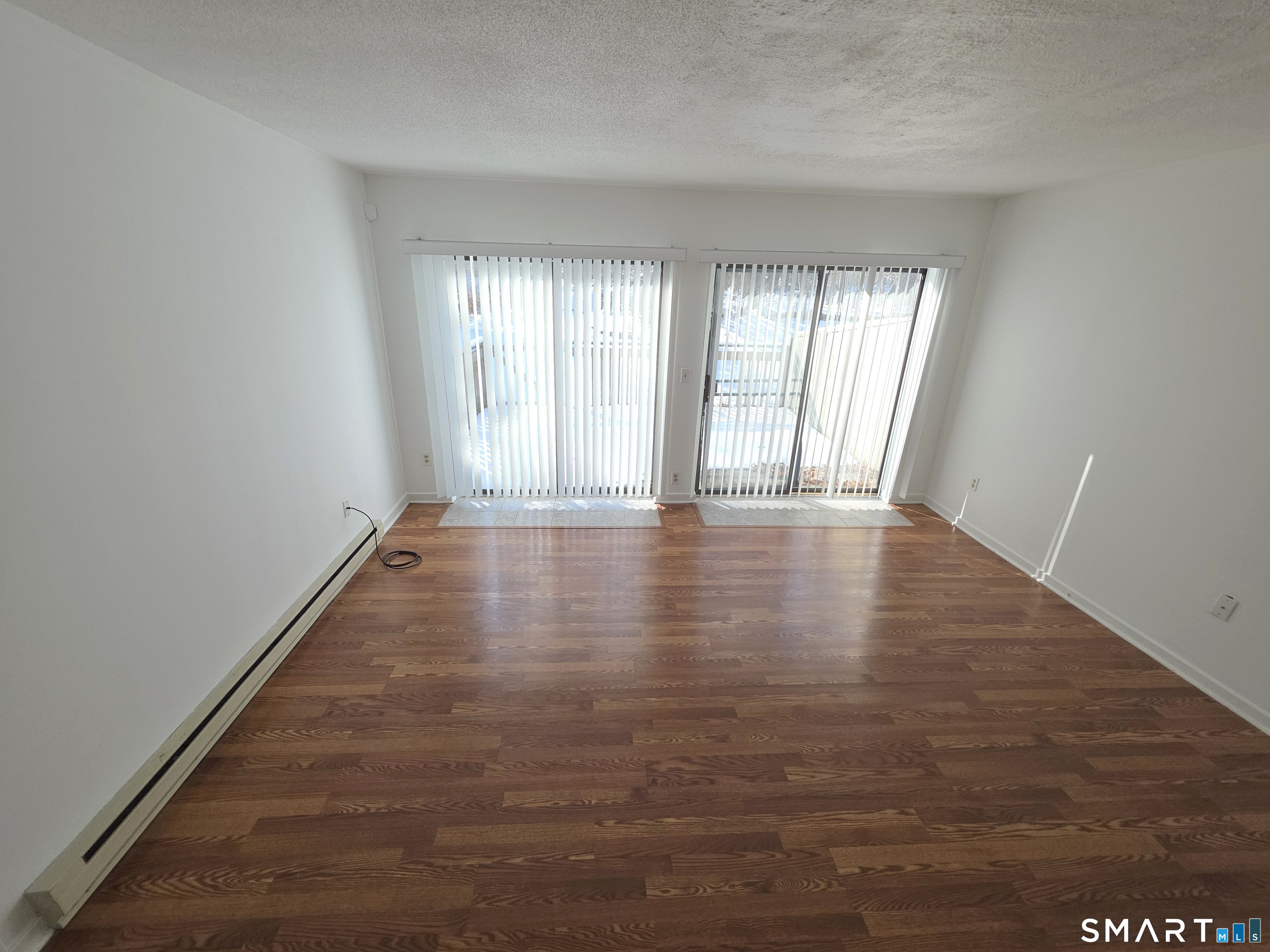 51 Brook Street, Unit 6A Naugatuck, CT 06770 - Photo 10 of 32 a view of an empty room with wooden floor and a window