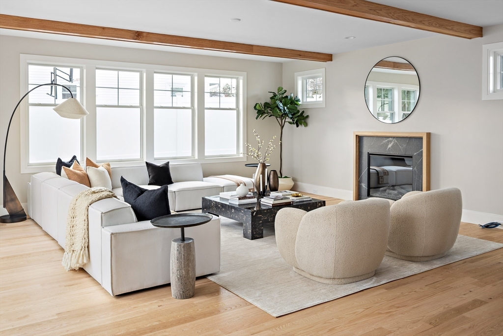 5 Hazel Lane Needham, MA 02494 - Photo 11 of 39 a living room with fireplace furniture and a large window