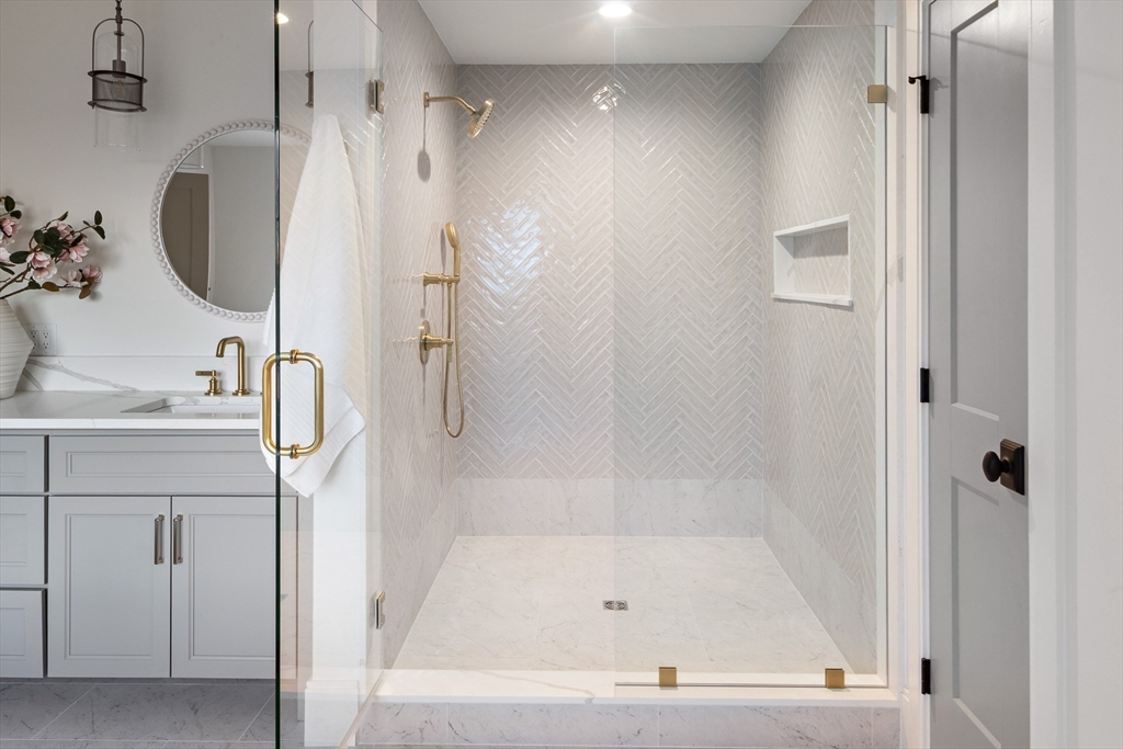 5 Hazel Lane Needham, MA 02494 - Photo 18 of 39 a bathroom with a tub sink and mirror