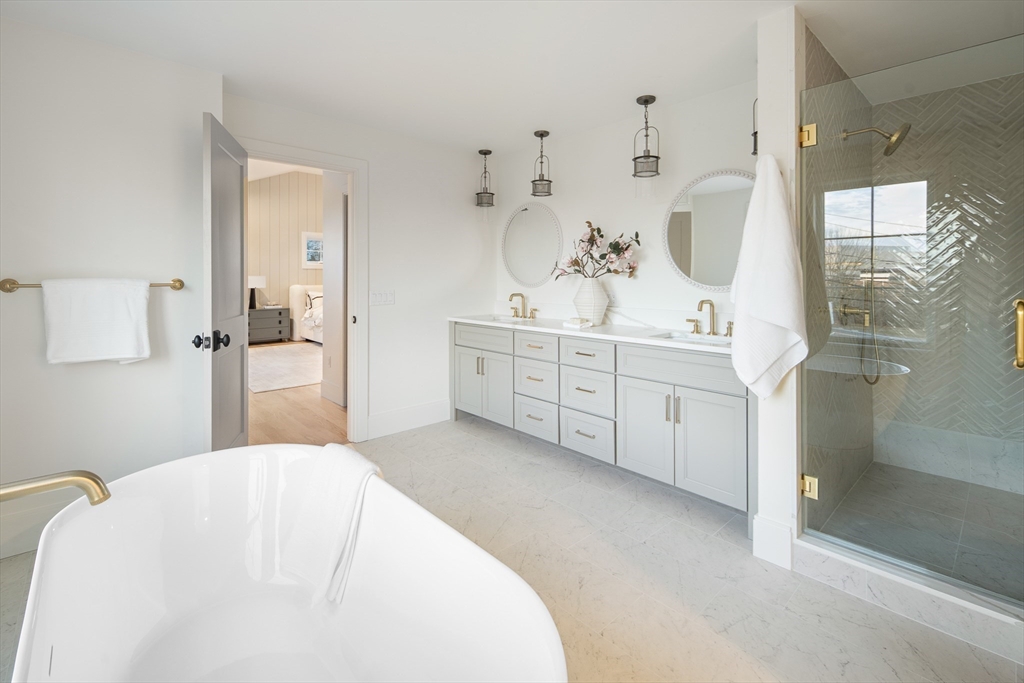 5 Hazel Lane Needham, MA 02494 - Photo 19 of 39 a spacious bedroom with a bed and a mirror