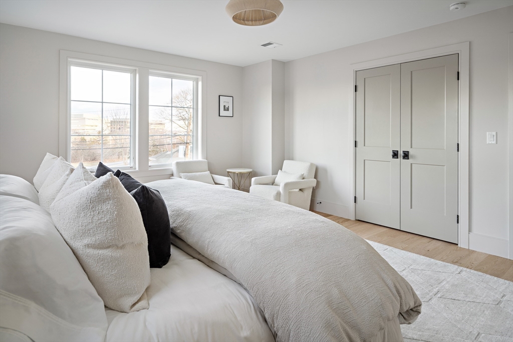 5 Hazel Lane Needham, MA 02494 - Photo 20 of 39 a bed room with a bed and a large window