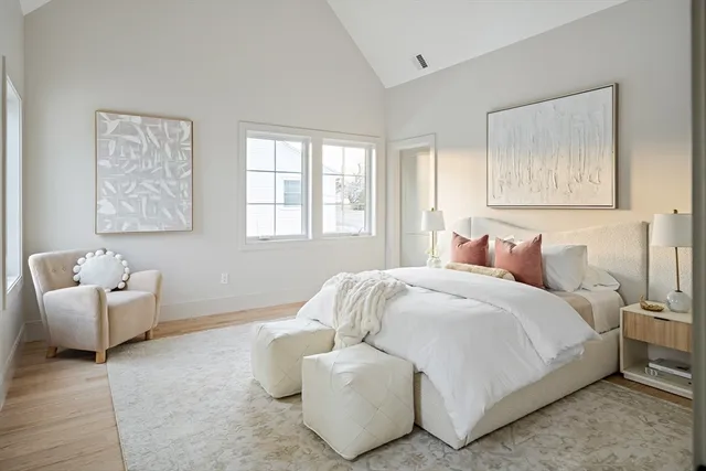 a bedroom with a bed and couch