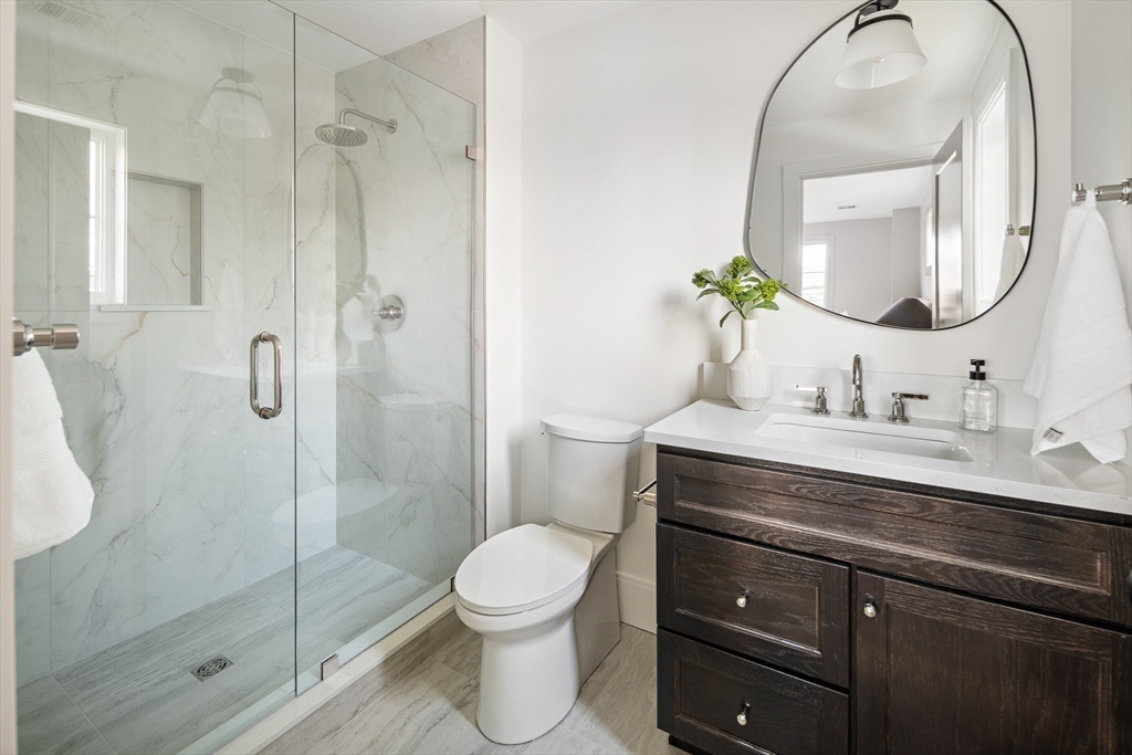 5 Hazel Lane Needham, MA 02494 - Photo 25 of 39 a bathroom with a sink a toilet and shower