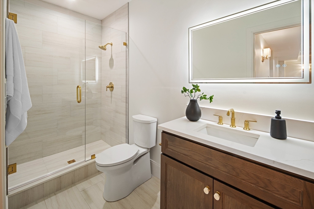 5 Hazel Lane Needham, MA 02494 - Photo 26 of 39 a bathroom with a sink a toilet and shower