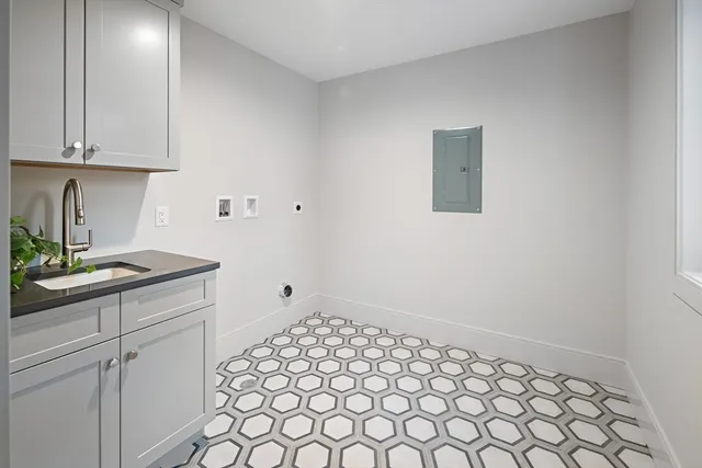 a room with a white cabinets and sink