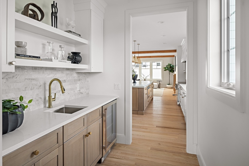 5 Hazel Lane Needham, MA 02494 - Photo 7 of 39 a view of a kitchen cabinets a sink and wooden floor