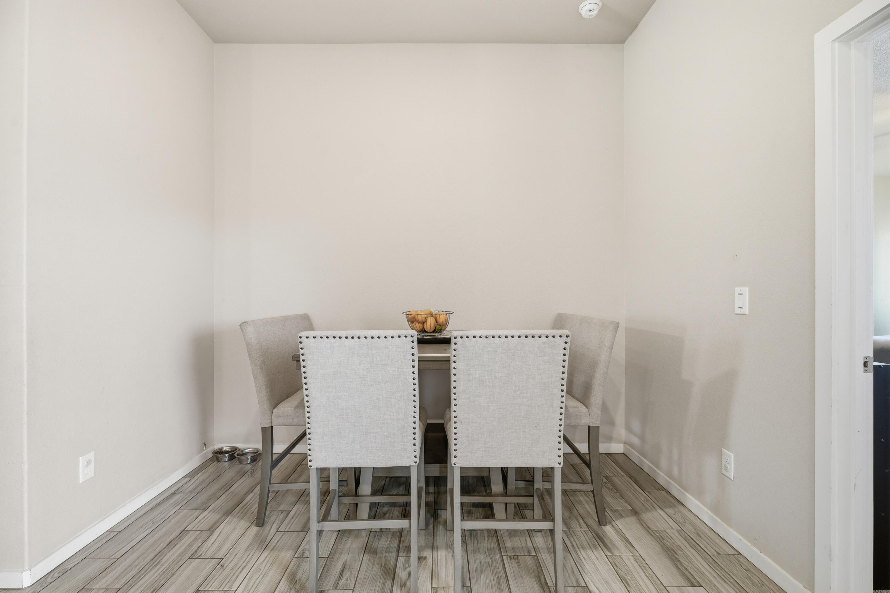 1919 140th Street Lubbock, TX 79423 - Photo 11 of 23 a view of a dining room with furniture and wooden floor