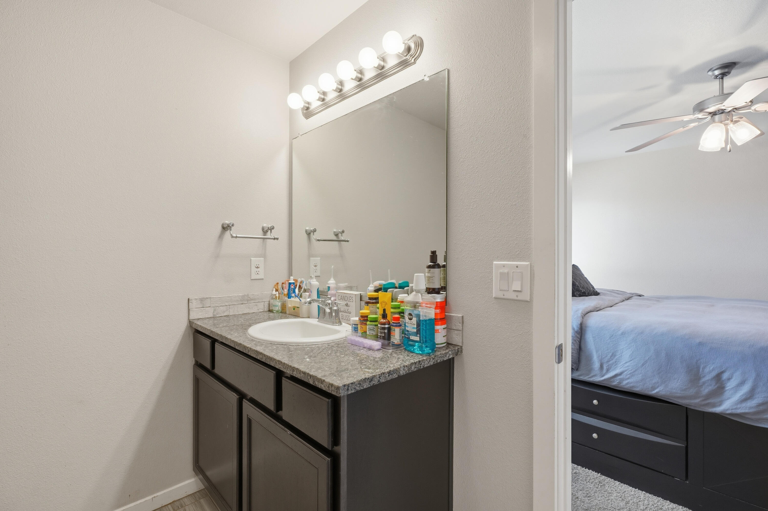 1919 140th Street Lubbock, TX 79423 - Photo 16 of 23 a bathroom with a sink and a mirror