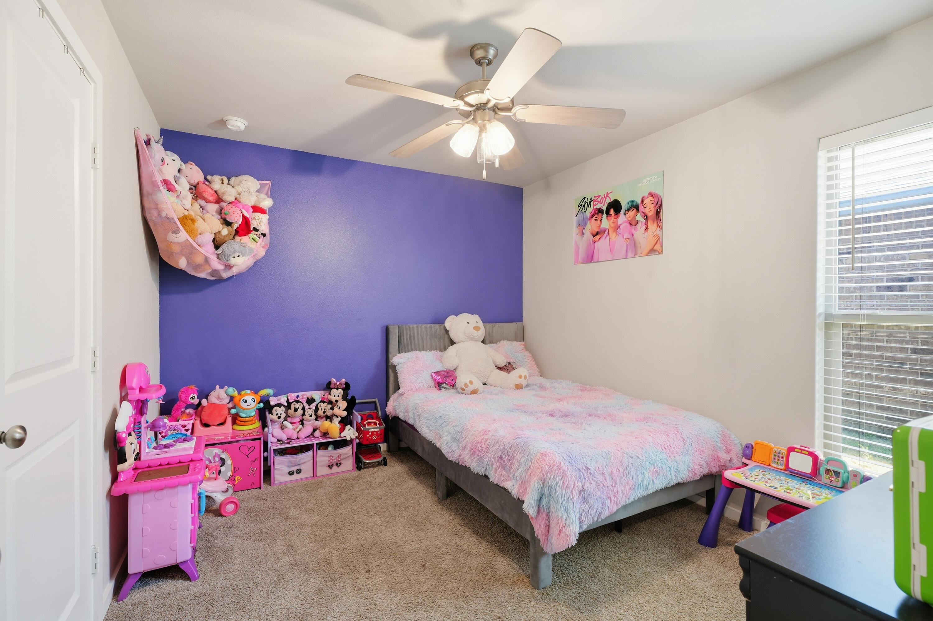 1919 140th Street Lubbock, TX 79423 - Photo 17 of 23 a bedroom with a bed and a chandelier