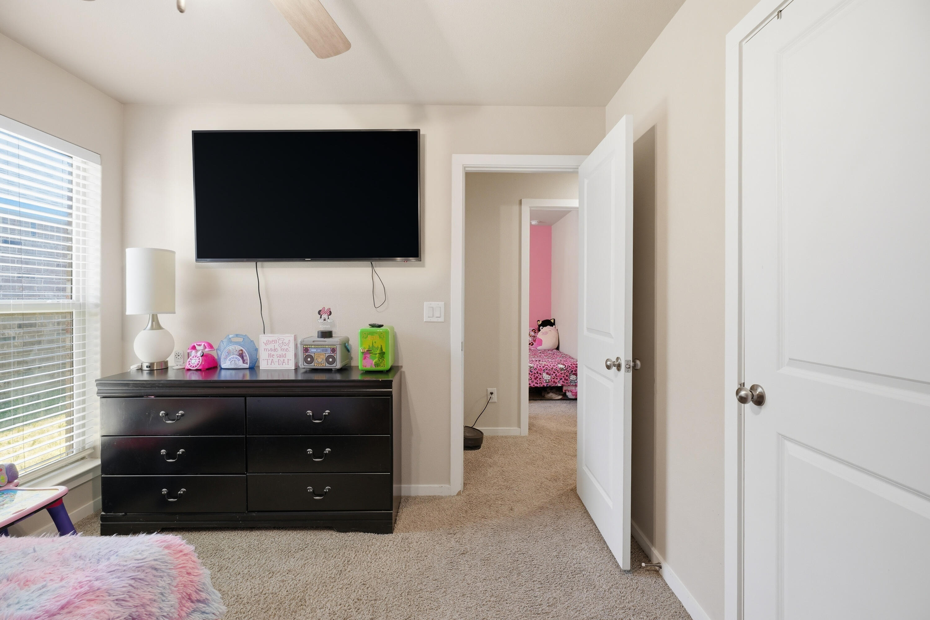 1919 140th Street Lubbock, TX 79423 - Photo 18 of 23 a living room with furniture and a flat screen tv