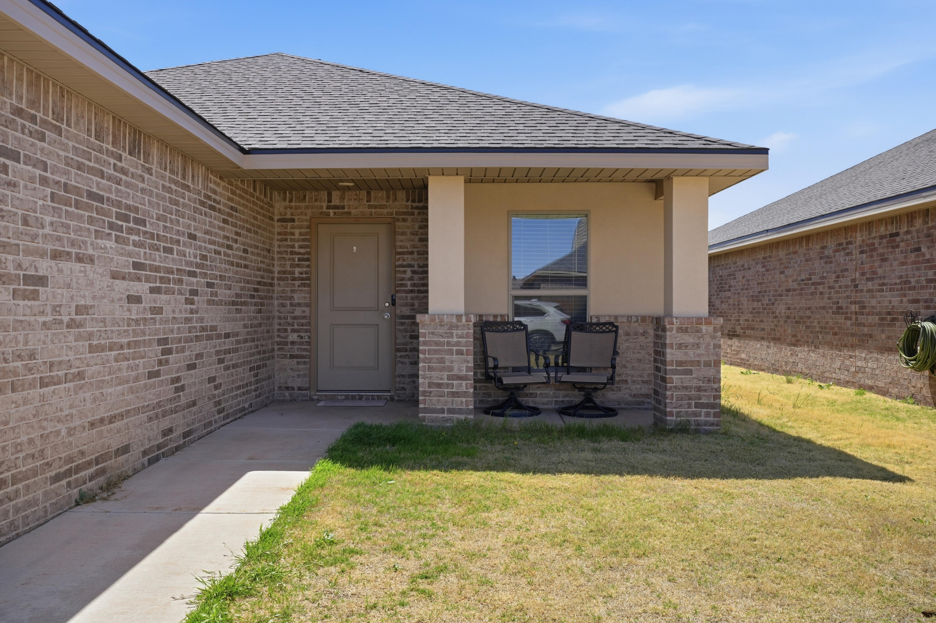 1919 140th Street Lubbock, TX 79423 - Photo 3 of 23 a front view of a house with a yard