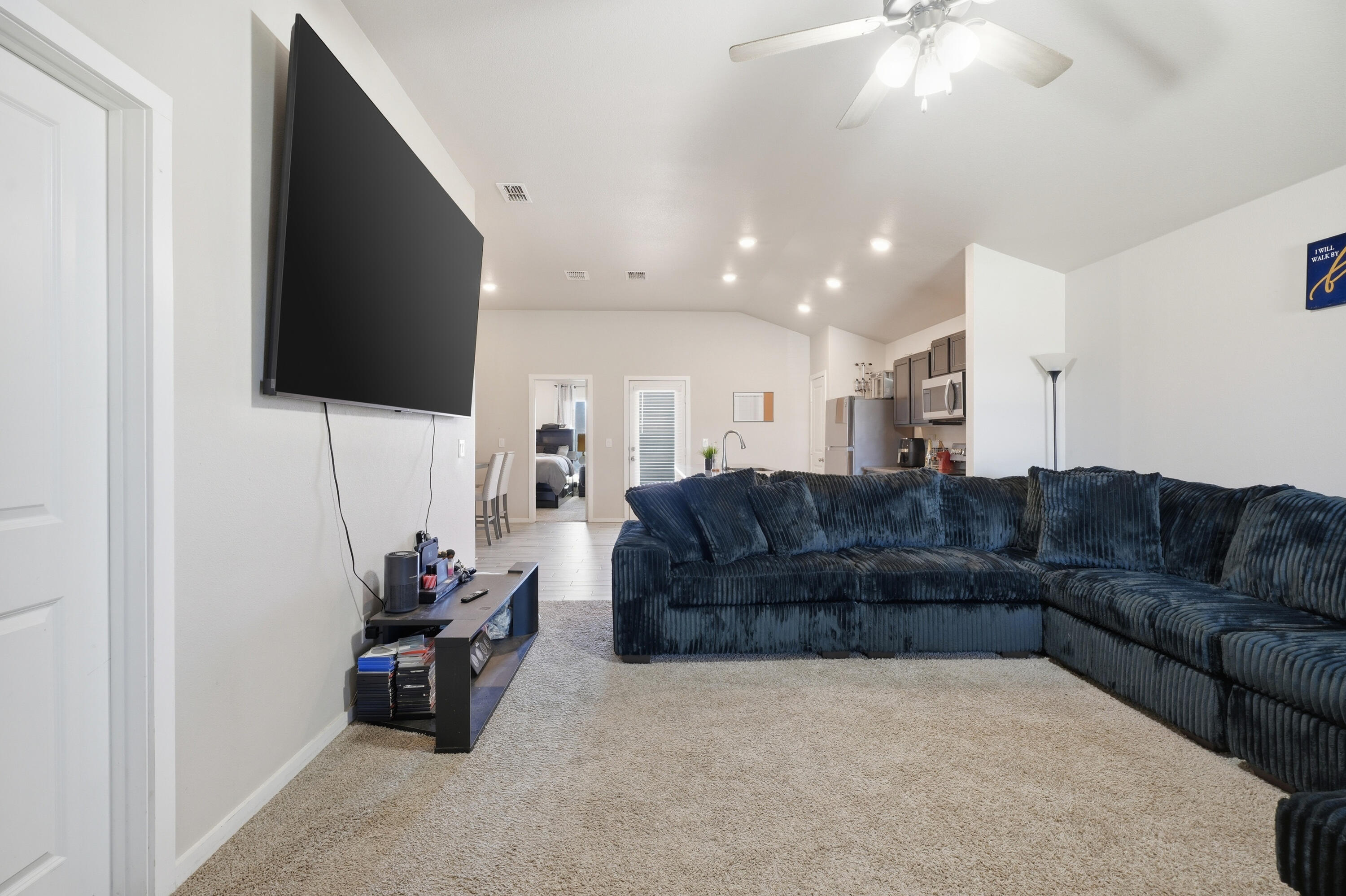 1919 140th Street Lubbock, TX 79423 - Photo 5 of 23 a living room with furniture and a flat screen tv
