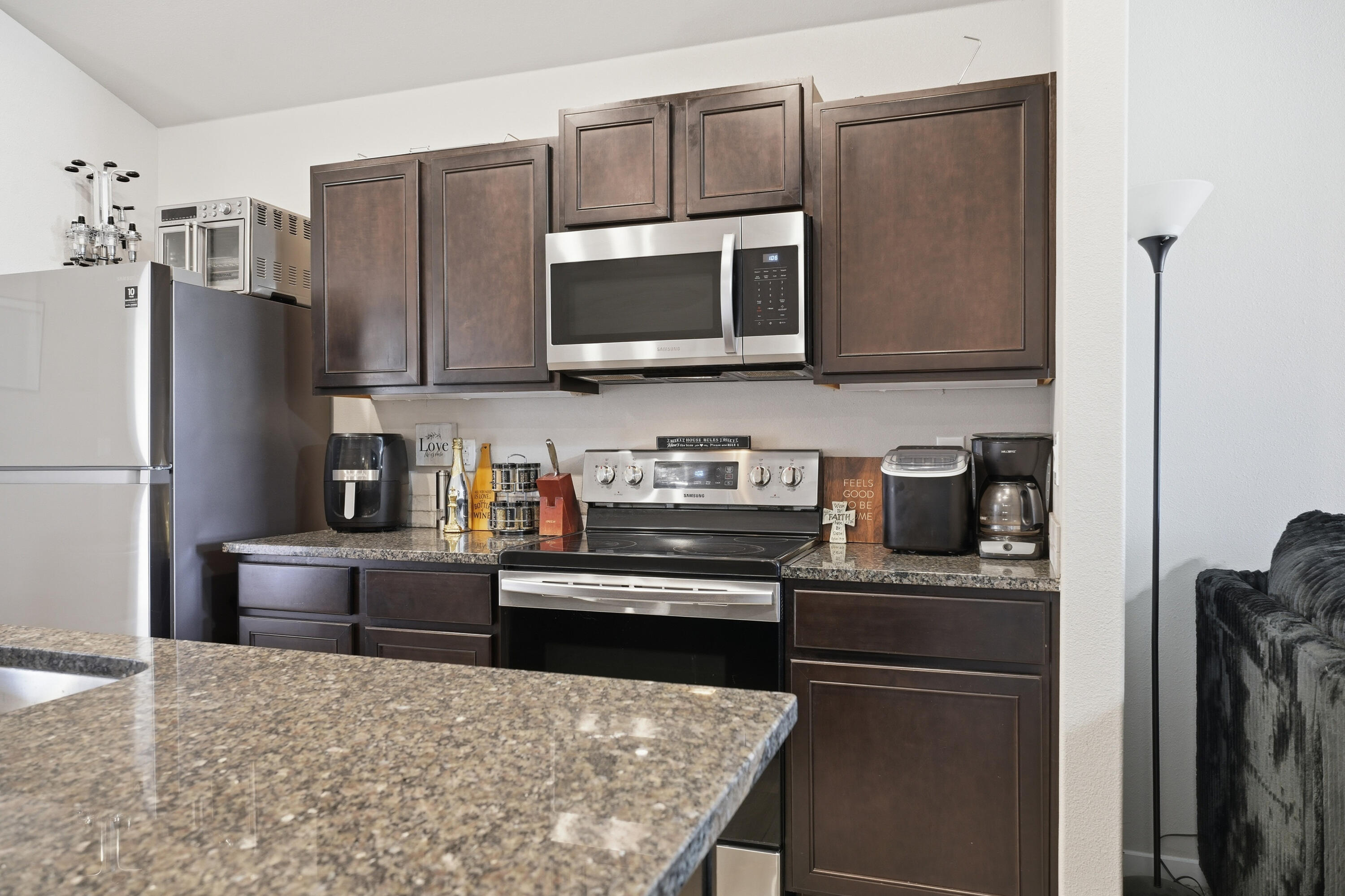 1919 140th Street Lubbock, TX 79423 - Photo 10 of 23 a kitchen with stainless steel appliances granite countertop a refrigerator stove and microwave