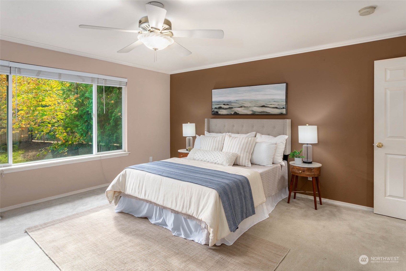 2710 236th Street Southeast Bothell, WA 98021 - Photo 17 of 30 a bedroom with a bed and a painting on the wall