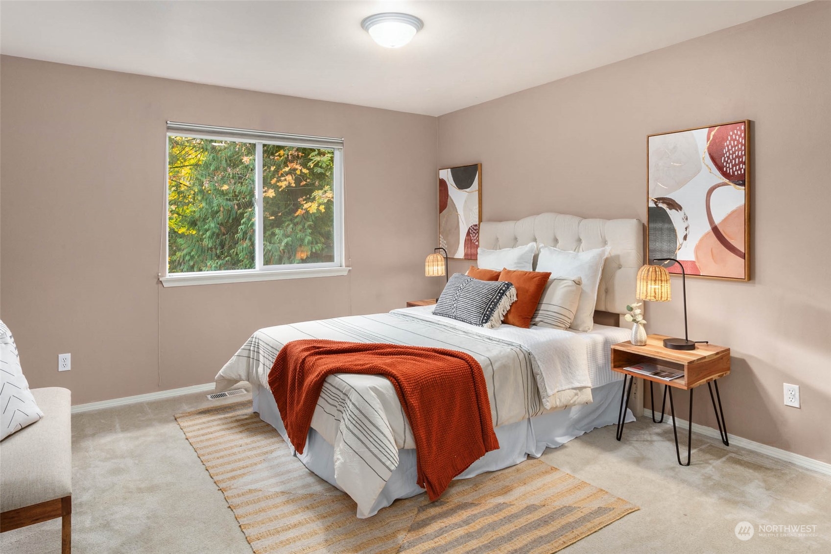 2710 236th Street Southeast Bothell, WA 98021 - Photo 21 of 30 a bed sitting in a bedroom next to a window