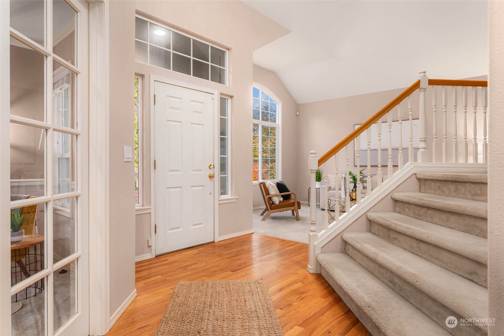 2710 236th Street Southeast Bothell, WA 98021 - Photo 24 of 30 a view of a hallway with wooden floor and staircase