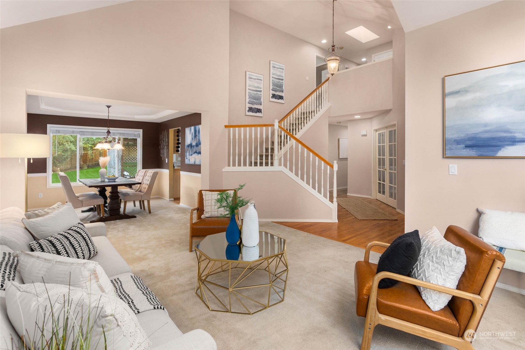 2710 236th Street Southeast Bothell, WA 98021 - Photo 5 of 30 a living room with furniture and a chandelier