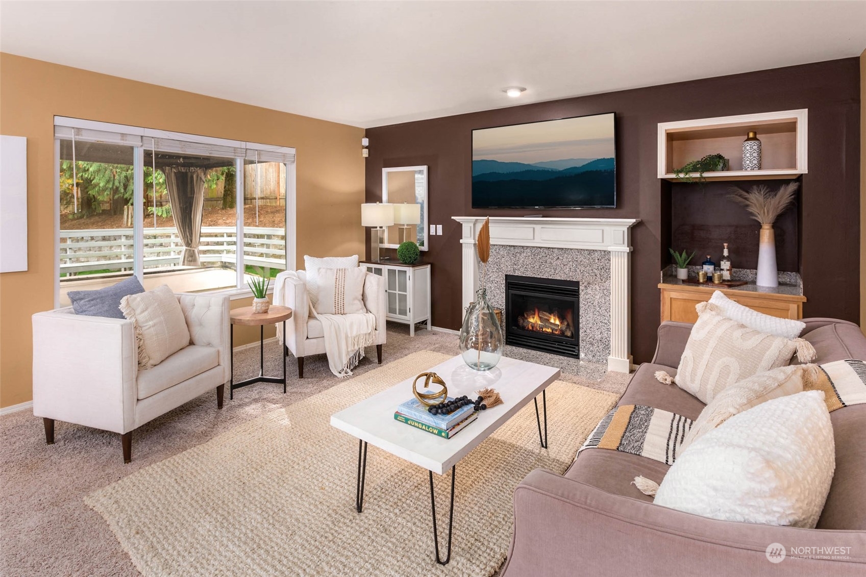 2710 236th Street Southeast Bothell, WA 98021 - Photo 9 of 30 a living room with furniture fireplace and flat screen tv