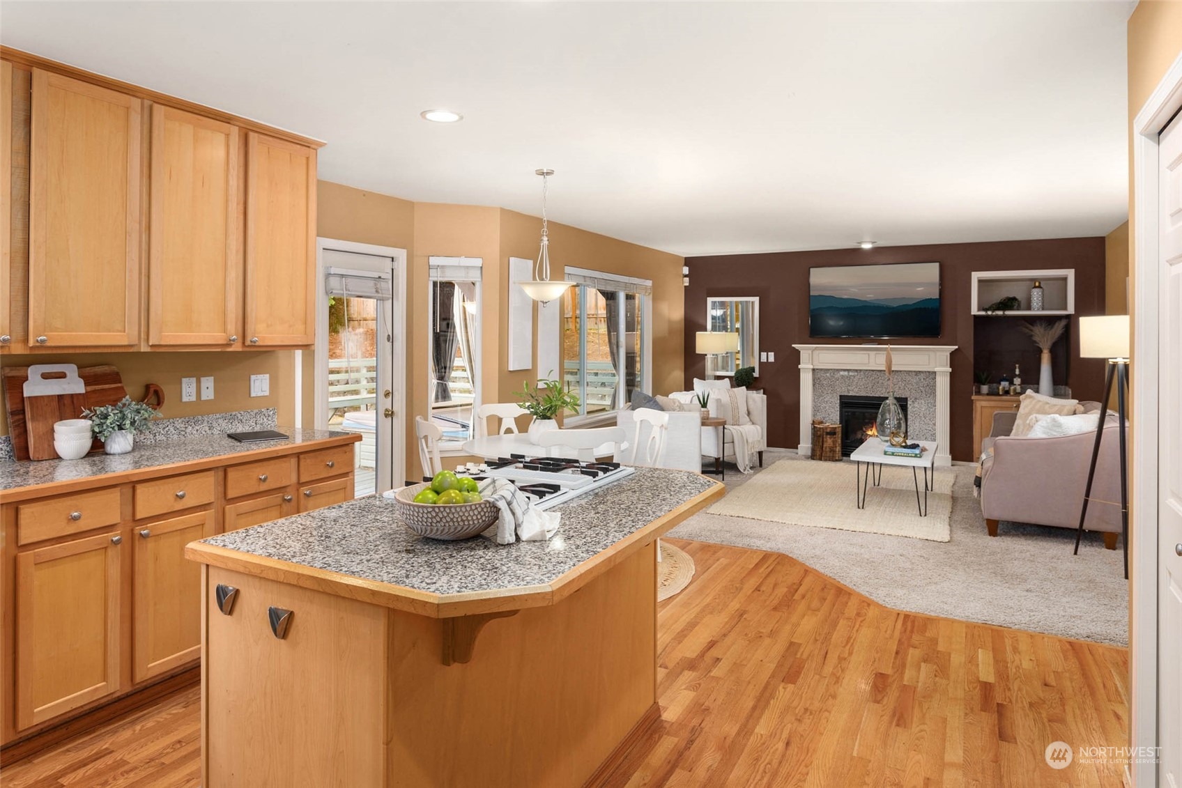 2710 236th Street Southeast Bothell, WA 98021 - Photo 10 of 30 a living room with furniture a fireplace and a flat screen tv