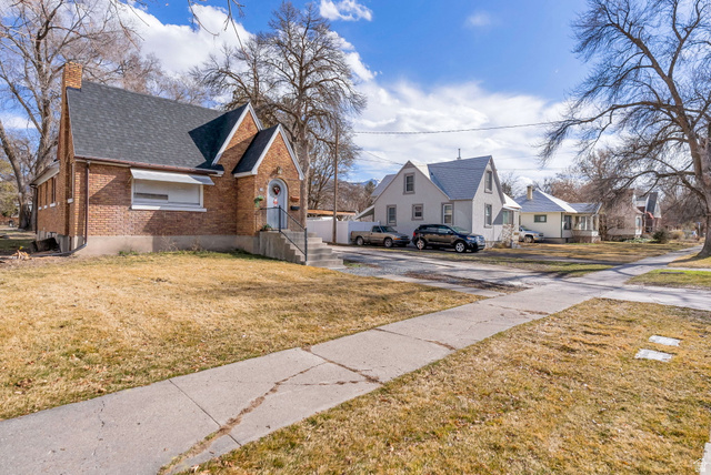 654 North 100 East Logan, UT 84321 - Photo 3 of 41 View of grassy yard featuring a residential view