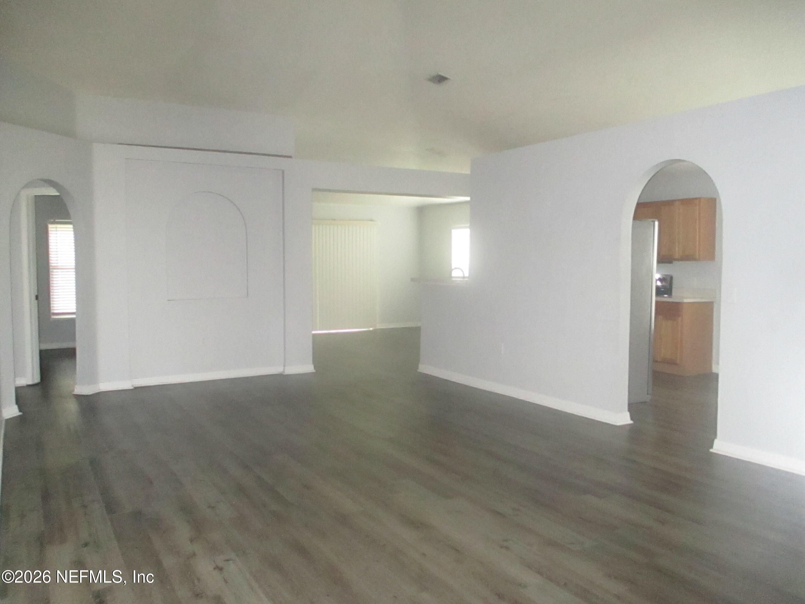 738 North 5th Street Macclenny, FL 32063 - Photo 3 of 23 a view of empty room with wooden floor