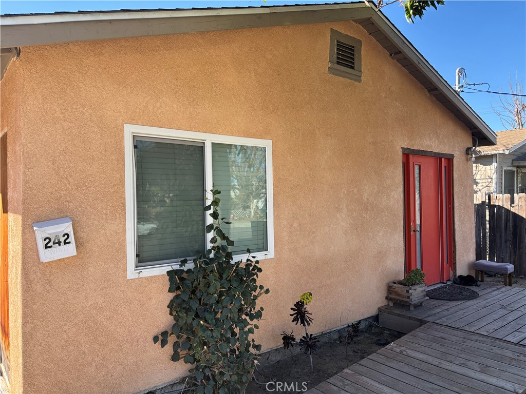 242 East M Street Colton, CA 92324 - Photo 2 of 19 a front view of a house with a yard