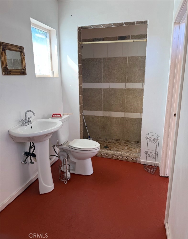 242 East M Street Colton, CA 92324 - Photo 6 of 19 a bathroom with a sink toilet and a mirror