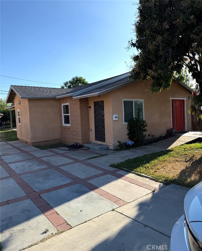 242 East M Street Colton, CA 92324 - Photo 7 of 19 a view of a house with a patio