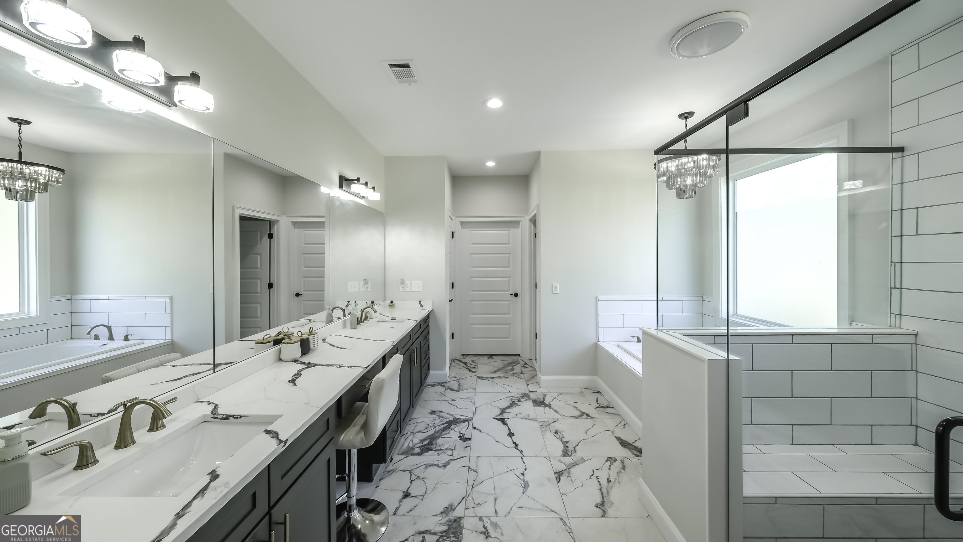 2392 Welcome Road Roopville, GA 30170 - Photo 26 of 43 a spacious bathroom with a double vanity sink mirror and shower