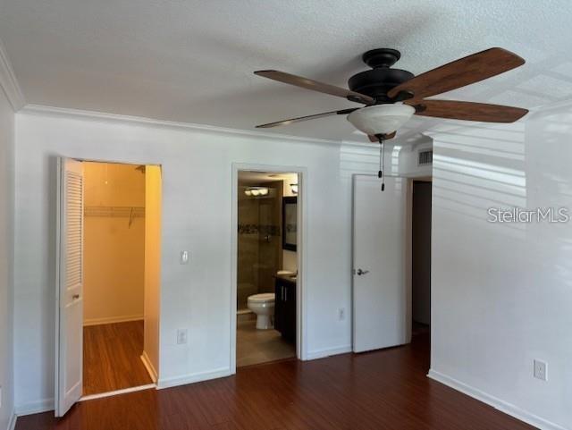 1261 Pine Ridge Circle West, Unit E2 Tarpon Springs, FL 34688 - Photo 14 of 16 wooden floor in an empty room